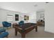 Entertaining game room with billiards table, accent chairs, and a nearby desk at 288 Links Terrace Blvd, Daytona Beach, FL 32124