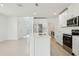 Bright kitchen with stainless steel appliances, white cabinetry, and an island with seating at 288 Links Terrace Blvd, Daytona Beach, FL 32124