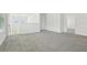Bright and airy loft space featuring neutral walls and plush carpeting, with natural light from nearby windows at 288 Links Terrace Blvd, Daytona Beach, FL 32124