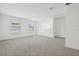 Expansive loft space features plush carpet, natural light, and versatile design at 288 Links Terrace Blvd, Daytona Beach, FL 32124