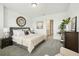 Relaxing main bedroom features soothing decor, plush carpeting, and an ensuite entrance at 288 Links Terrace Blvd, Daytona Beach, FL 32124