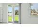 Bright room featuring sliding glass patio doors, window, and access to outdoor space at 288 Links Terrace Blvd, Daytona Beach, FL 32124