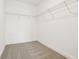 Uncluttered walk-in closet with neutral carpet and metal shelving at 288 Links Terrace Blvd, Daytona Beach, FL 32124