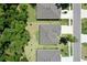 Aerial view of houses showing roofs and landscaping with neighboring street and tall trees at 3029 Adrian Dr, Ormond Beach, FL 32174