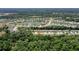 Aerial view of the neighborhood with a lake and community amenities nearby at 3029 Adrian Dr, Ormond Beach, FL 32174