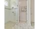 Elegant bathroom featuring a glass-enclosed shower, marble flooring, and a serene ambiance at 3029 Adrian Dr, Ormond Beach, FL 32174