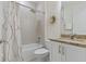 Well lit bathroom featuring granite countertops, modern fixtures, and a shower/tub combo at 3029 Adrian Dr, Ormond Beach, FL 32174