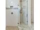 Bright bathroom featuring a glass shower, tiled walls, and a clean, modern design at 3029 Adrian Dr, Ormond Beach, FL 32174