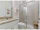 Bright bathroom with granite countertops, modern fixtures, and a glass enclosed shower at 3029 Adrian Dr, Ormond Beach, FL 32174