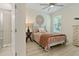 Comfortable bedroom with wood-look floors, ceiling fan, and lots of natural light at 3029 Adrian Dr, Ormond Beach, FL 32174
