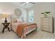Bedroom with a ceiling fan, wood-look floors, and lots of natural light at 3029 Adrian Dr, Ormond Beach, FL 32174