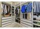 Walk-in closet with custom shelving, shoe racks, drawers, and hanging rods maximizes storage and organization at 3029 Adrian Dr, Ormond Beach, FL 32174