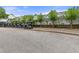 Image features golf cart parking at community golf course with lush green trees around building at 3029 Adrian Dr, Ormond Beach, FL 32174