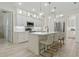 Bright kitchen with an island, white cabinets, pendant lighting, stainless steel appliances, and modern finishes at 3029 Adrian Dr, Ormond Beach, FL 32174