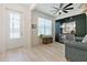 View of the living room featuring a decorative front door and bar area with cooler at 3029 Adrian Dr, Ormond Beach, FL 32174