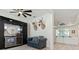 Living room with a bar, wine storage, wall decorations, and a view to a Gathering room at 3029 Adrian Dr, Ormond Beach, FL 32174