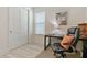 Bright office area with wood-look floors, a desk, and natural light at 3029 Adrian Dr, Ormond Beach, FL 32174