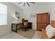 Cozy home office features wood-look floors, natural light, a ceiling fan and space to work at 3029 Adrian Dr, Ormond Beach, FL 32174