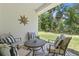 Comfortable outdoor patio with stylish furniture and peaceful backyard views at 3029 Adrian Dr, Ormond Beach, FL 32174