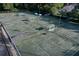 Aerial view of tennis courts with multiple players and well maintained surroundings at 3029 Adrian Dr, Ormond Beach, FL 32174