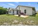 Scenic backyard with a patio, cozy seating, and lush green lawn at 920 N Lakewood Ter, Port Orange, FL 32127