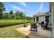 Backyard patio seating with canal waterfront view at 920 N Lakewood Ter, Port Orange, FL 32127