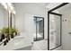 Bathroom featuring modern fixtures, a walk-in shower, and sliding glass doors to a private patio at 920 N Lakewood Ter, Port Orange, FL 32127