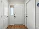 Bright entryway featuring a white front door and neutral walls leading into the home at 920 N Lakewood Ter, Port Orange, FL 32127