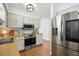 Kitchen featuring stainless steel appliances, including a microwave and refrigerator at 920 N Lakewood Ter, Port Orange, FL 32127