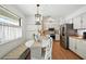 Bright kitchen featuring a stainless steel fridge and a cozy breakfast nook with a round table at 920 N Lakewood Ter, Port Orange, FL 32127