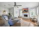 Comfortable living room with hardwood floors, stone fireplace, and ample seating at 920 N Lakewood Ter, Port Orange, FL 32127