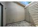 Enclosed patio area with white gravel, neutral siding and roofline view at 920 N Lakewood Ter, Port Orange, FL 32127