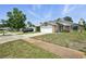 Well-kept home with stone accents and attached garage in a quiet neighborhood, offering comfort and curb appeal at 920 N Lakewood Ter, Port Orange, FL 32127