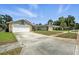 Neighborhood street view showcasing well-maintained homes with garages and driveways, nestled in a peaceful community setting at 920 N Lakewood Ter, Port Orange, FL 32127
