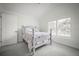 Calm bedroom features plush carpet and a window for natural light at 96 Grove St, Ormond Beach, FL 32174