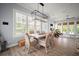 Bright dining room with a stylish chandelier and comfortable seating at 96 Grove St, Ormond Beach, FL 32174