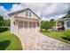Detached garage with stylish doors and well-maintained landscaping at 96 Grove St, Ormond Beach, FL 32174