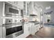 Bright kitchen features stainless steel Viking appliances and sleek white cabinetry with a gas cooktop at 96 Grove St, Ormond Beach, FL 32174