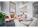 Stylish living room with fireplace, open layout into the dining and kitchen at 96 Grove St, Ormond Beach, FL 32174