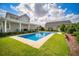 Gorgeous backyard pool area with lush landscaping at 96 Grove St, Ormond Beach, FL 32174