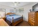 Cozy bedroom with neutral walls, wood furnishings, and a comfortable bed at 1 Beechwood Dr, Ormond Beach, FL 32176