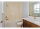 Bathroom featuring a tub-shower combo and wood vanity at 9762 Neruda St, Orlando, FL 32827