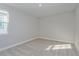 Bright bedroom with neutral carpet, a window that provides lots of natural light at 9762 Neruda St, Orlando, FL 32827