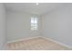 A well-lit bedroom featuring neutral walls, carpet, and a window at 9762 Neruda St, Orlando, FL 32827
