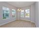 Bright dining room featuring large windows and modern light fixture at 9762 Neruda St, Orlando, FL 32827