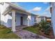 Exterior view of a blue house with a brick-paved patio at 9762 Neruda St, Orlando, FL 32827