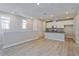Open-concept kitchen with white cabinets and a black countertop island at 9762 Neruda St, Orlando, FL 32827