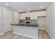 Modern kitchen with white cabinets and stainless steel appliances at 9762 Neruda St, Orlando, FL 32827