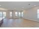 Bright open-concept living room features recessed lighting, smooth walls, and stunning light wood floors at 9762 Neruda St, Orlando, FL 32827