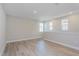 Spacious living room with ample natural light and plank flooring at 9762 Neruda St, Orlando, FL 32827